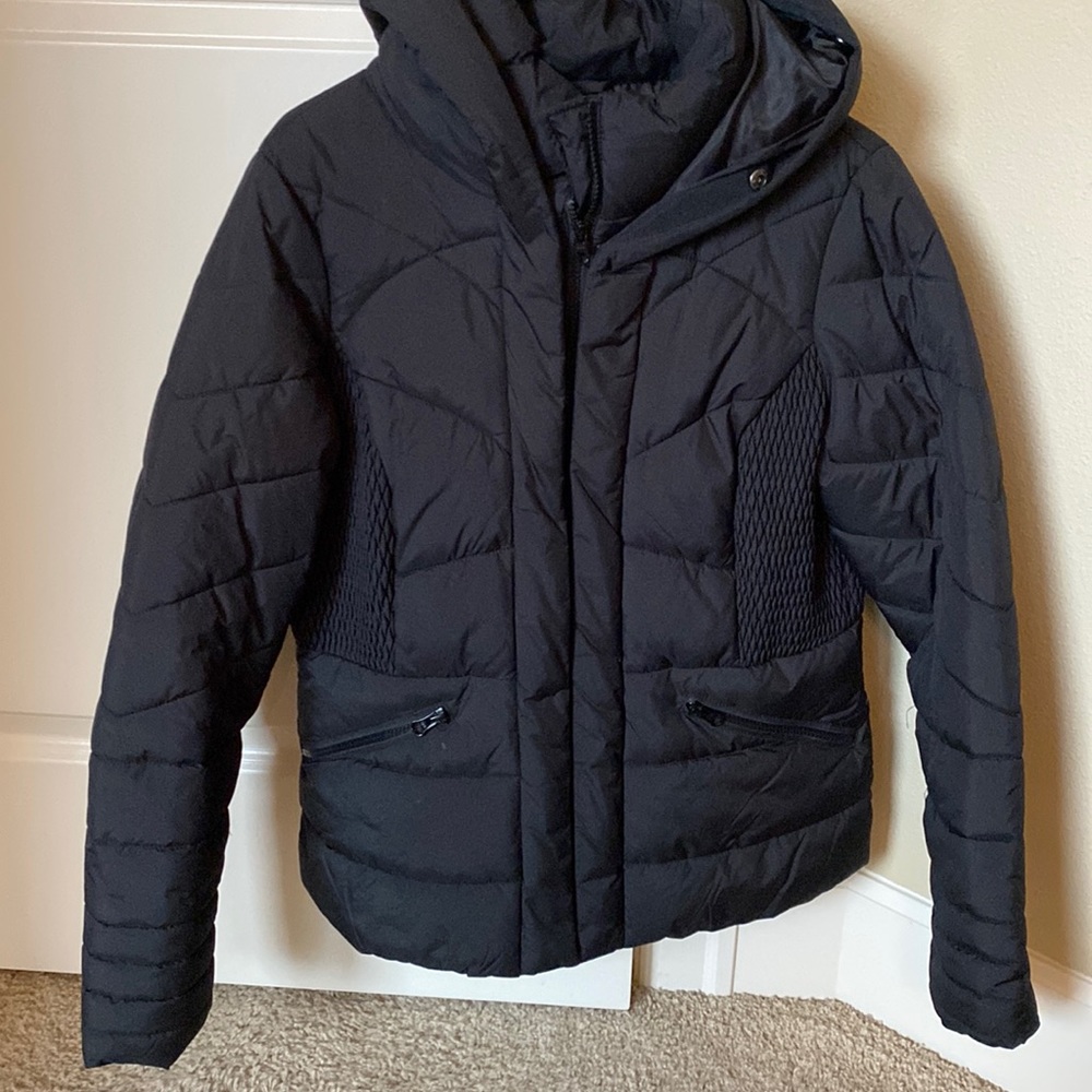 Black warm puffer coat with synched waist.